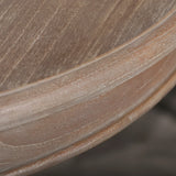 Closeup of round wooden table edge with natural grain texture
