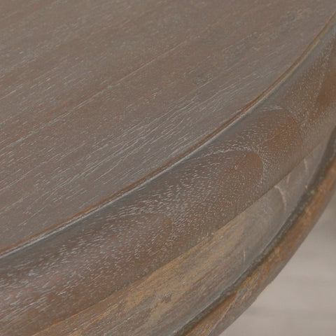 Close-up of dark wood coffee table edge showing grain and finish