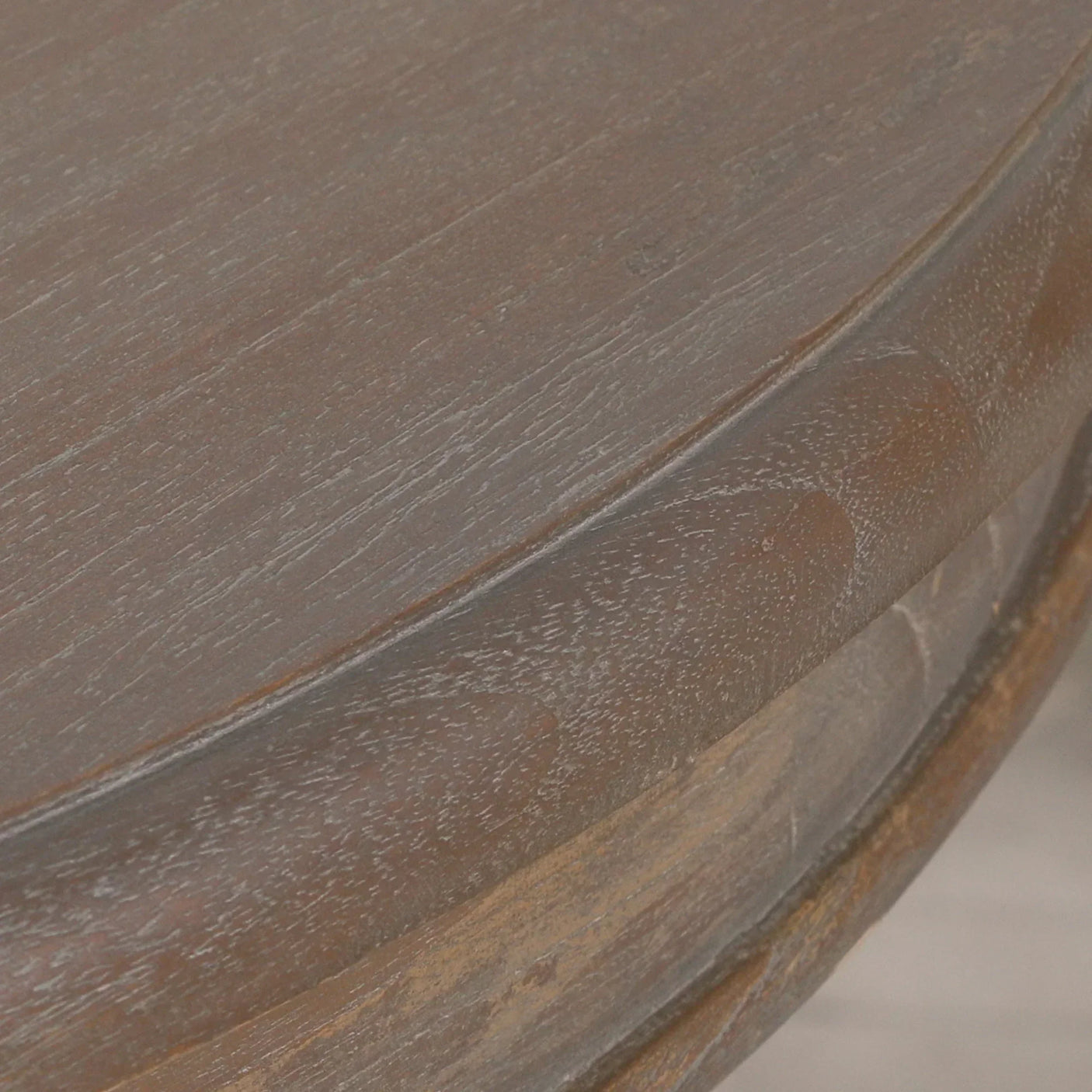 Close-up of dark wood coffee table edge showing grain and finish