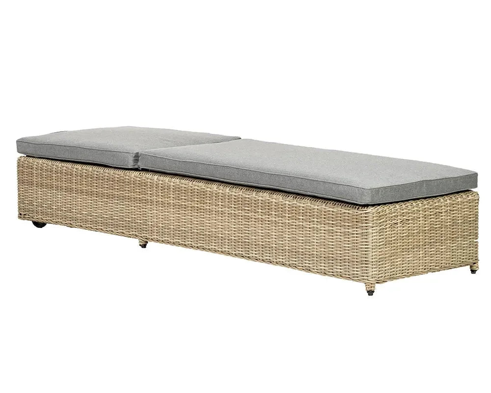 Rattan sunlounger with grey cushions, rectangular shape, side angle view