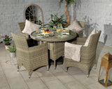 Rattan garden dining set with glass round table and four armchairs on tiled patio