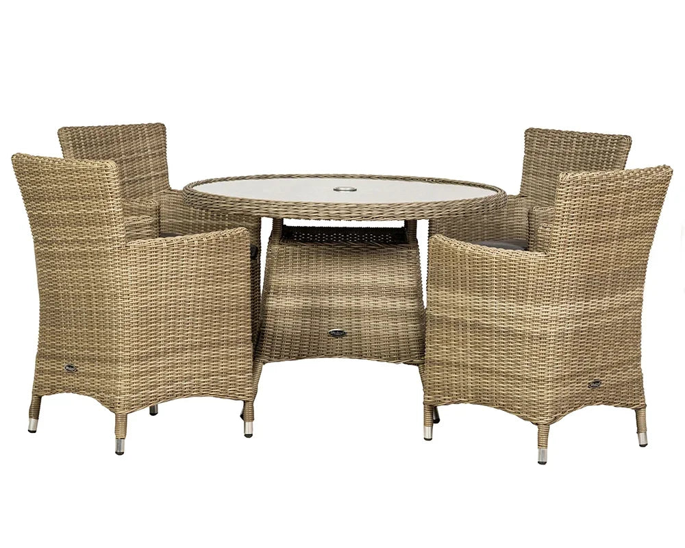 Rattan dining set with round glass table and four wicker chairs