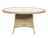 Round rattan garden table with glass top and central umbrella hole, beige wicker finish