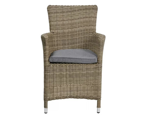 Natural rattan garden chair with grey cushion and armrests, front view