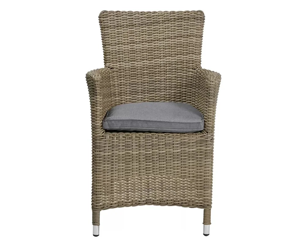 Natural rattan garden chair with grey cushion and armrests, front view