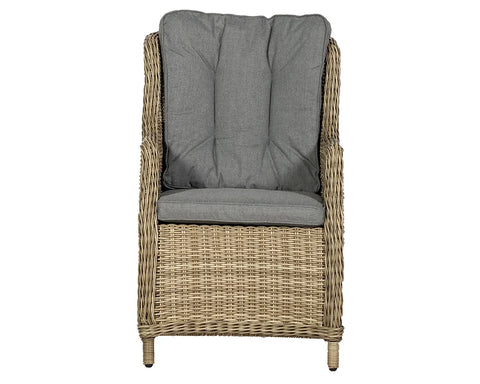 Rattan armchair with high back and grey padded cushions, front view