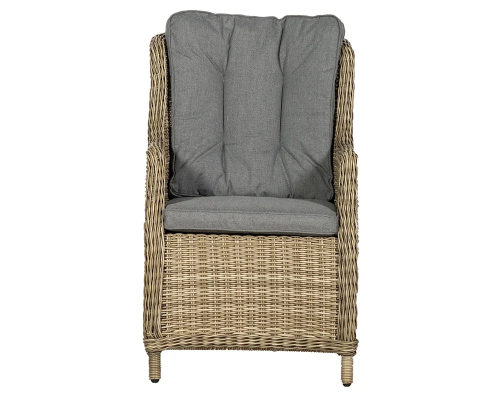 Rattan armchair with high back and grey padded cushions, front view