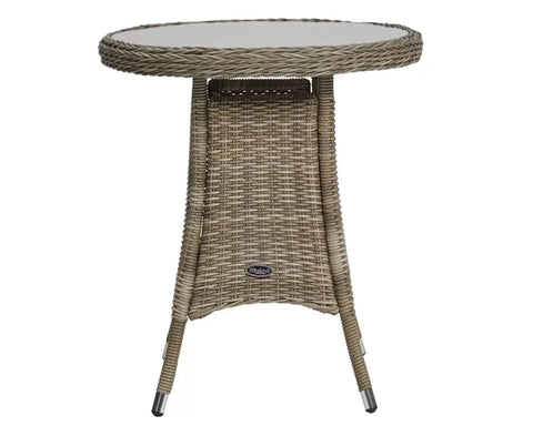 Round rattan garden table with glass top and angled legs, suitable for outdoor dining