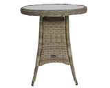 Round rattan garden table with glass top and angled legs, suitable for outdoor dining