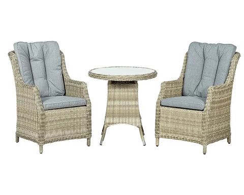 Rattan garden bistro set with round glass table and two cushioned armchairs in grey