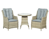 Rattan garden bistro set with round glass table and two cushioned armchairs in grey