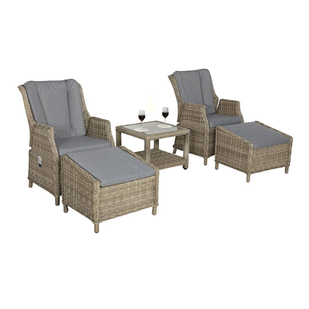Rattan garden lounge set with two chairs, matching footstools, side table, and grey cushions