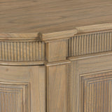 Close-up of a rustic wooden buffet sideboard featuring fluted detailing and a smooth finish.