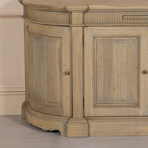 Rustic wooden buffet sideboard with fluted detailing and curved edges.
