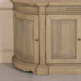Rustic wooden buffet sideboard with fluted detailing and curved edges.