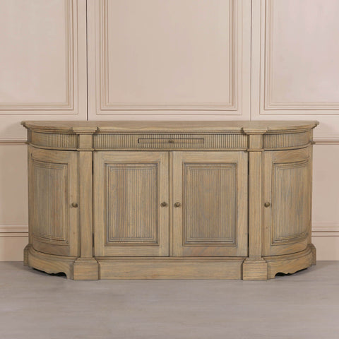 Rustic wooden buffet sideboard with fluted detailing and three doors.