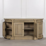 Rustic wooden fluted buffet sideboard with two doors and open shelving.