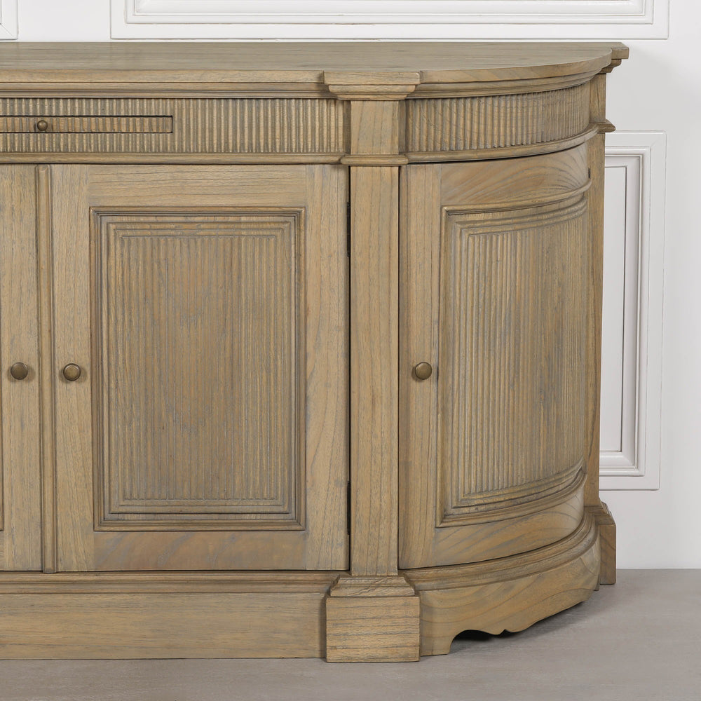 Rustic wooden buffet sideboard with fluted detailing and a curved design.