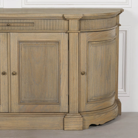 Rustic wooden buffet sideboard with fluted detailing and a curved design.
