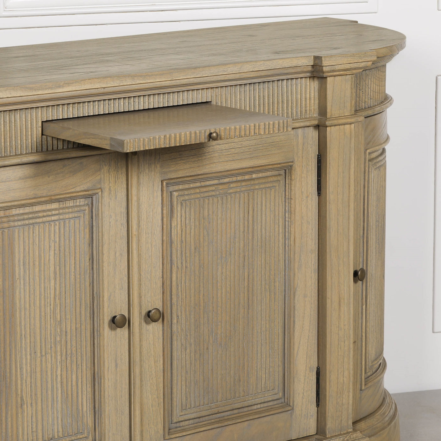 Rustic wooden buffet sideboard with fluted detailing and a small pull-out drawer.