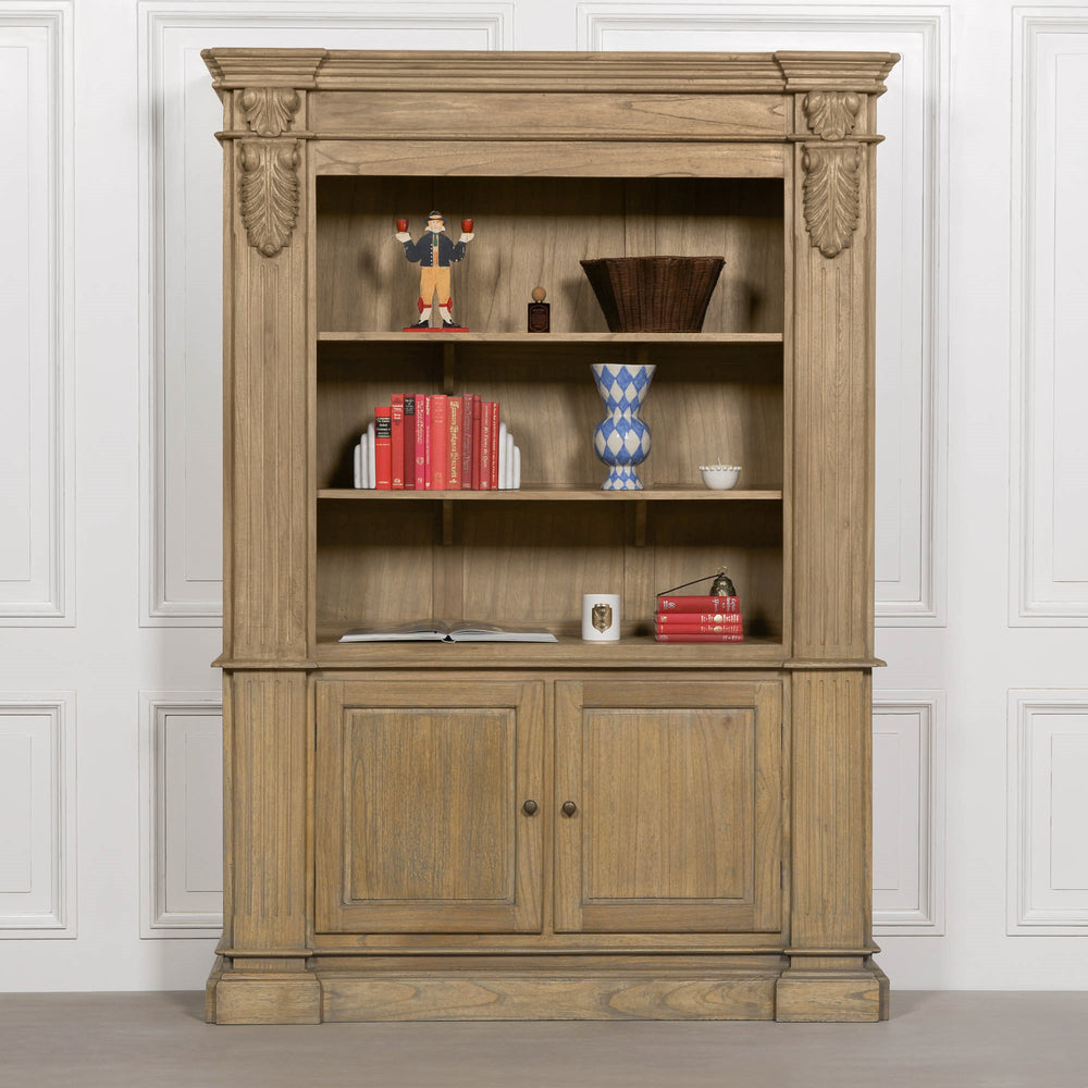 Large rustic open bookcase with decorative detailing, featuring multiple shelves and a closed cabinet at the bottom.