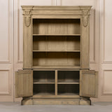 Large rustic open bookcase with decorative detailing and two lower cabinet doors.