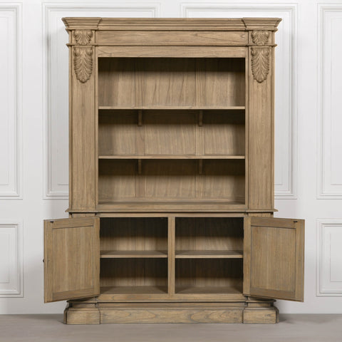 Large rustic open bookcase with multiple shelves and two lower doors, featuring decorative detailing.