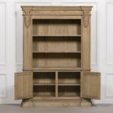Large rustic open bookcase with multiple shelves and two lower doors, featuring decorative detailing.