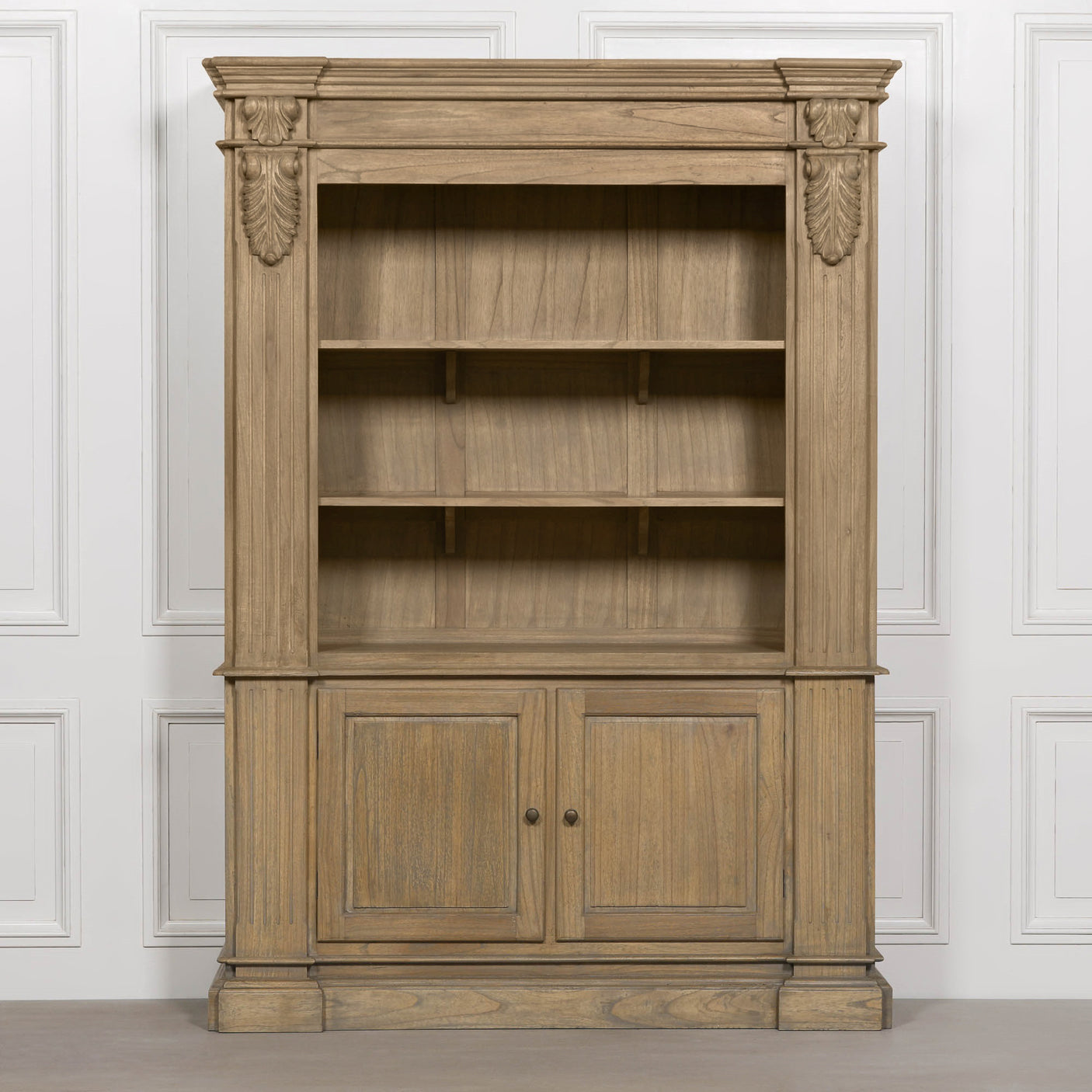 Large rustic open bookcase with four shelves and two lower doors, featuring decorative detailing.