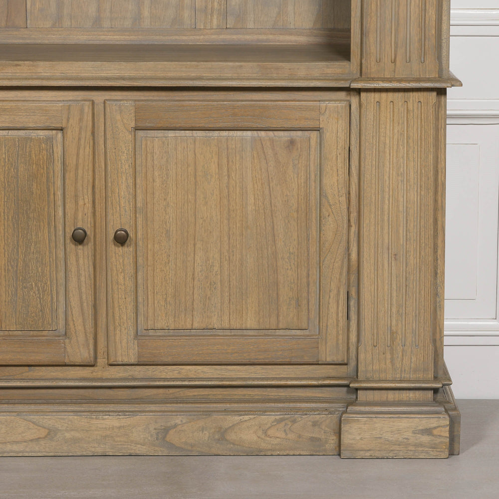 Large rustic open bookcase with two lower cabinet doors and detailed woodwork.