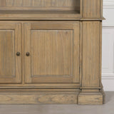 Large rustic open bookcase with two lower cabinet doors and detailed woodwork.