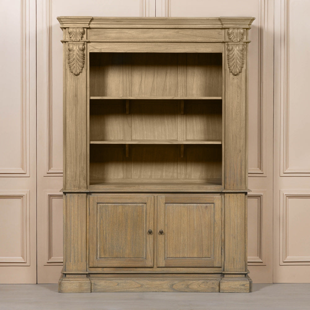 Large rustic open bookcase with decorative detailing and two lower doors, set against a neutral background.