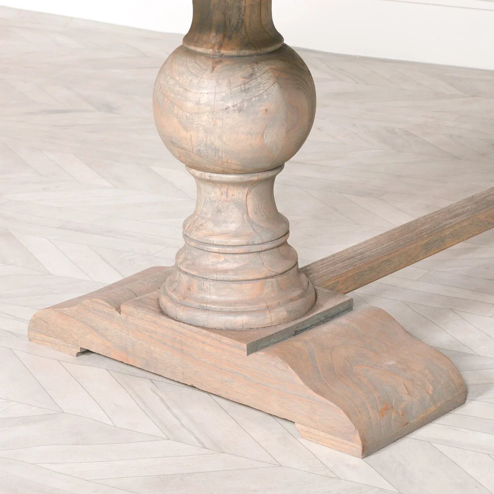 Rustic wooden dining table base with carved pedestal and natural wood grain finish