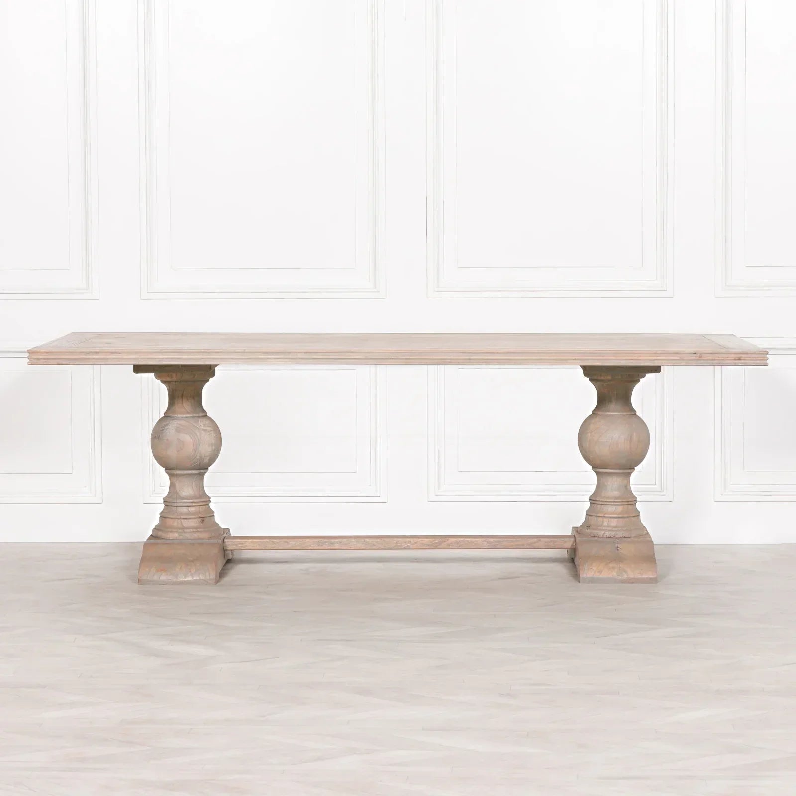 Solid wood dining table with double pedestal base and natural oak finish