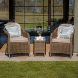 Rattan garden bistro set with two cushioned chairs and a matching side table on patio