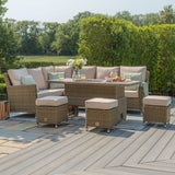 Rattan corner garden furniture set with beige cushions, glass-topped table and matching stools