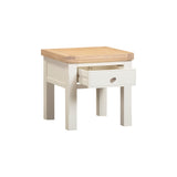 Small wooden side table with a drawer on a white background