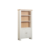 Wooden bookshelf with white base and light wood top on a white background