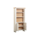 Wooden bookshelf with a white base and open doors on a white background