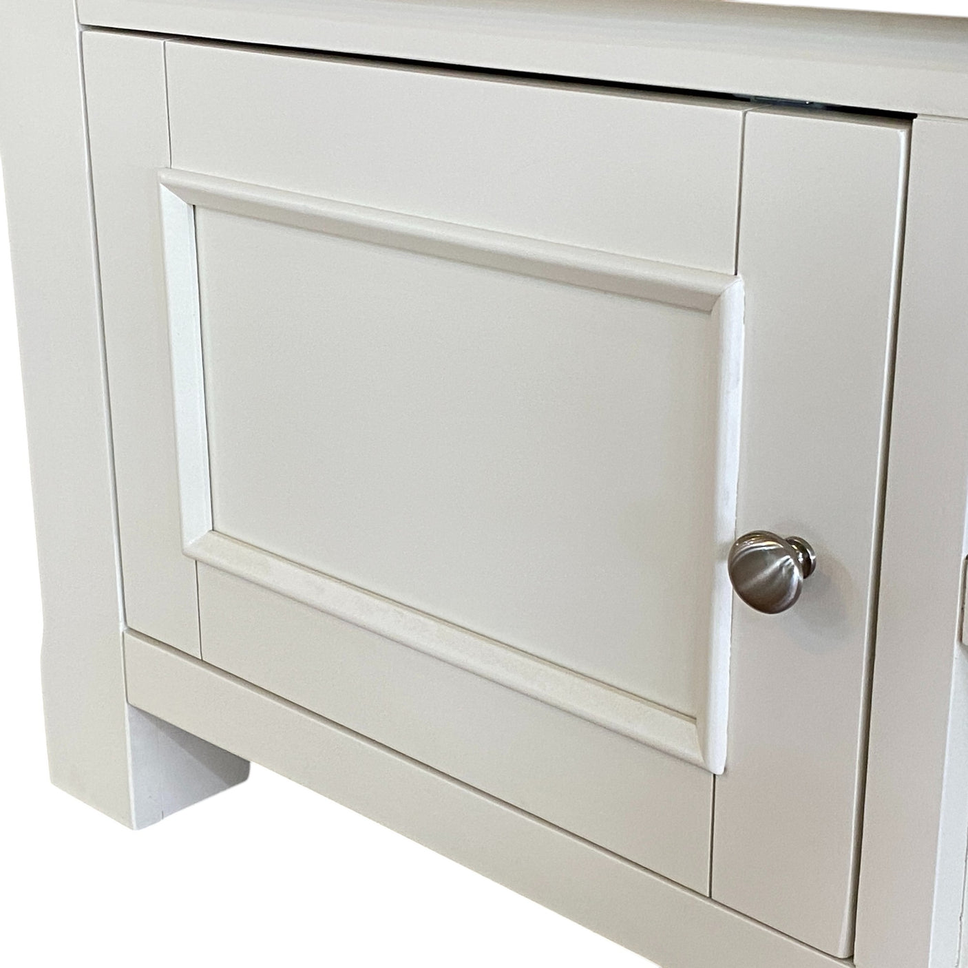 White cabinet with a door and silver handle on a white background