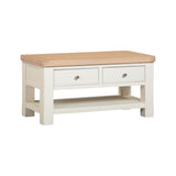 Wooden coffee table with a light finish on a white background