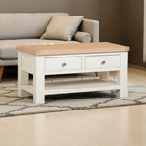 Coffee table with wooden top and white base in a living room setting