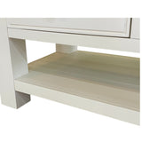 Close-up of a white wooden cabinet with a shelf on a white background