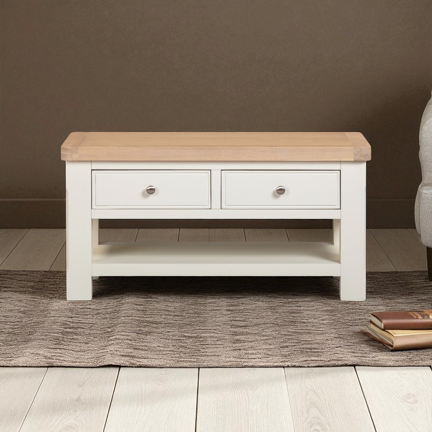 Wooden coffee table with two drawers on a wooden floor.
