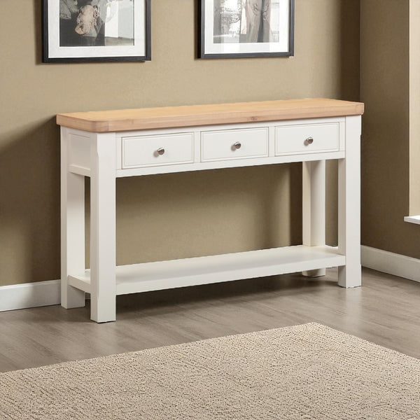 White console table with wooden top against a beige wall