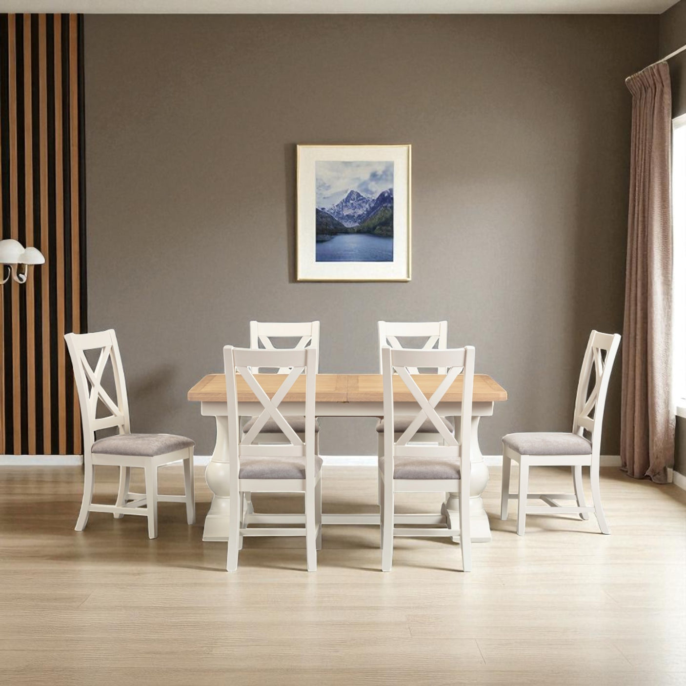 Dining room with a wooden table and white chairs against a gray wall with a framed picture.