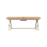 Wooden table with white base on a white background