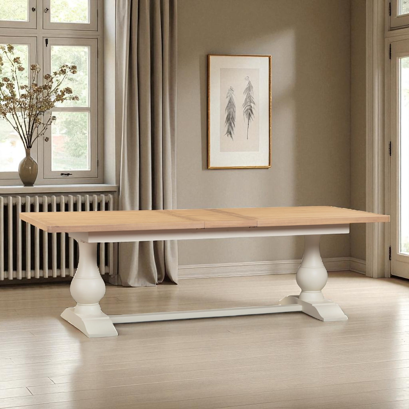 Wooden dining table with white legs in a room with windows and a radiator.