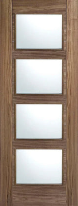 Walnut glazed internal door with four clear glass panels and natural wood grain finish