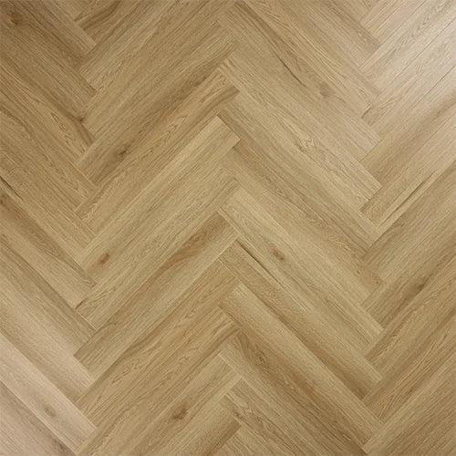 Weathered cedar wood flooring in a herringbone pattern with natural grain texture